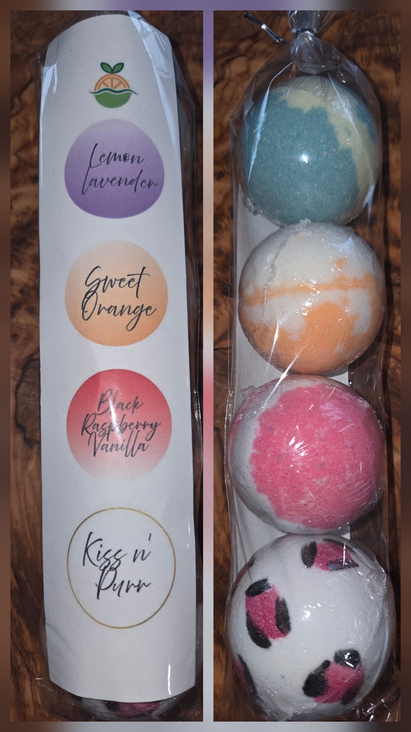 Packaging of 4 small bath bombs with scents listed: Lemon Lavender, Sweet Orange, Black Raspberry Vanilla, Kiss n Purr fragrances