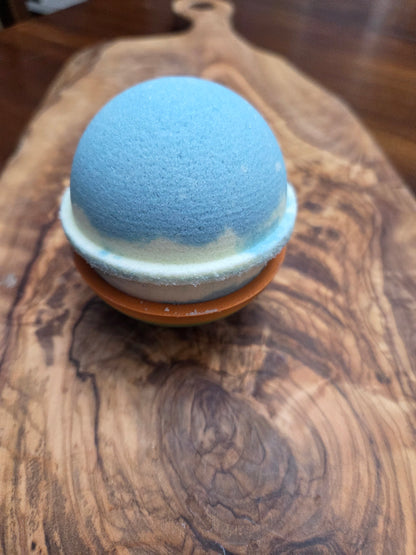 light yellow and purple bath bomb, Lemon and lavender Fragrance on a wooden surface to show