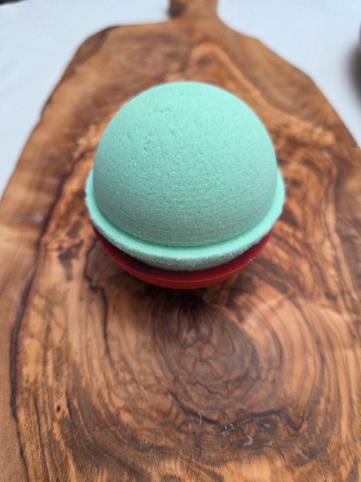 Green bath bomb, Lemongrass and green Tea Fragrance on a wooden surface to show