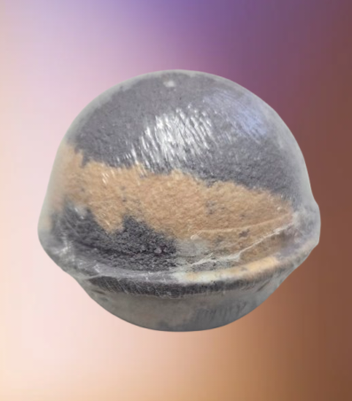 Round Bath Bomb Blackraspberry Vanilla scent . Background picture of light orange and purple.